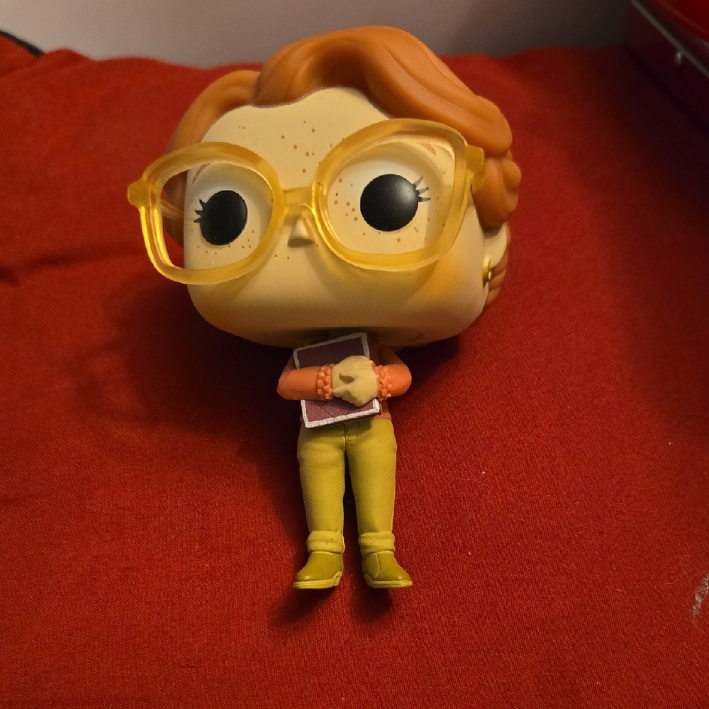 Funko Pop Figure with Yellow Glasses and Orange Hair